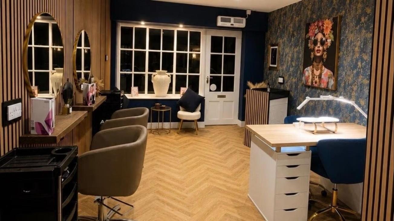 The nail bar at AJ Hair & Nails, with the window seat and navy velvet chair