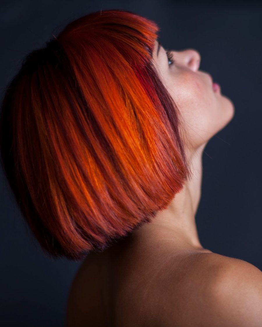 Vivid copper-red bob, glossy and precision cut