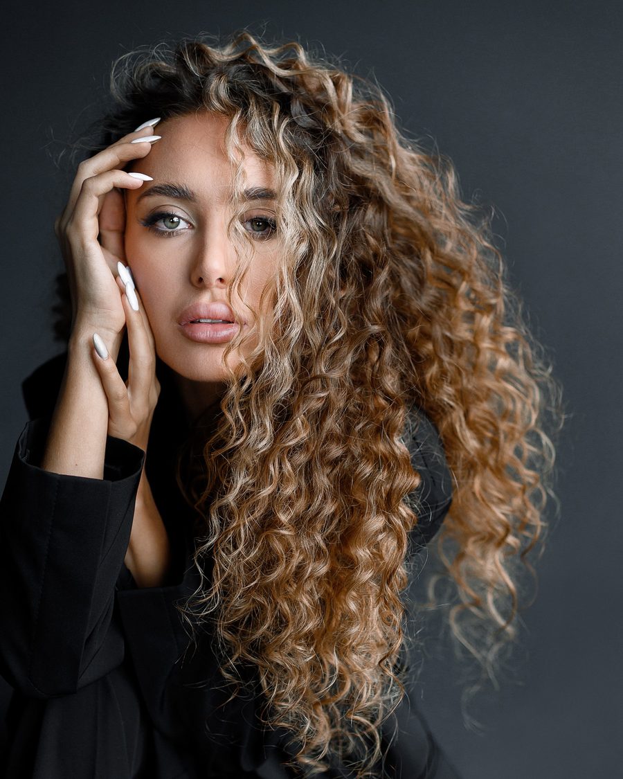 Long golden curls, styled and defined