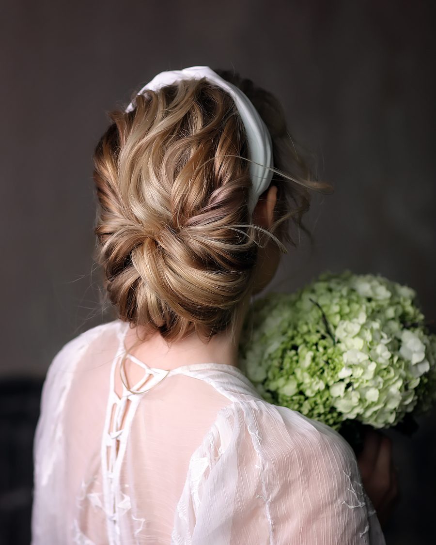 Bride from behind with a soft textured low bun