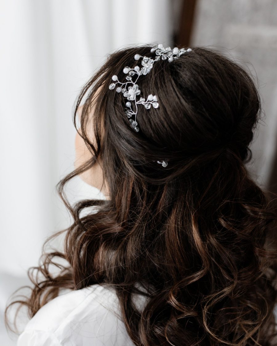 Loose dark waves, half pinned, with a crystal hair vine